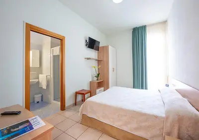 Letto o letti in una camera di Hotel Ginevra