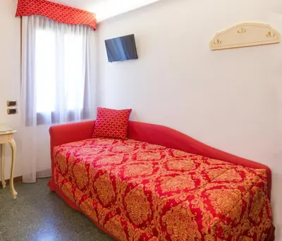 Letto o letti in una camera di Hotel Leonardo