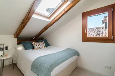 Letto o letti in una camera di Rialto Mini