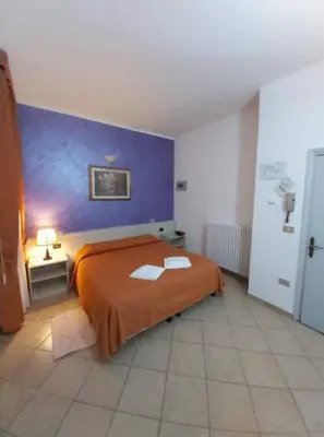 Letto o letti in una camera di Hotel Arcella