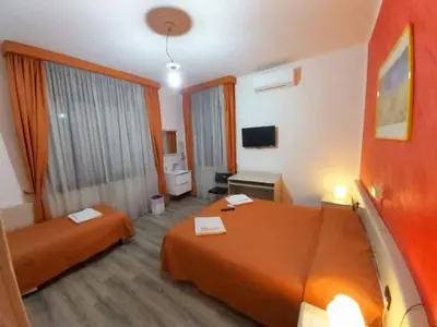 Letto o letti in una camera di Hotel Arcella