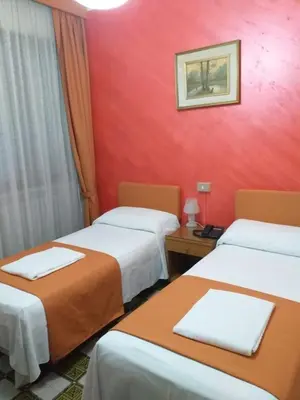 Letto o letti in una camera di Hotel Arcella