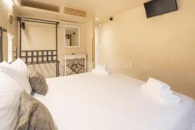 Letto o letti in una camera di VeNICe Cera Ca' del Gondoliere