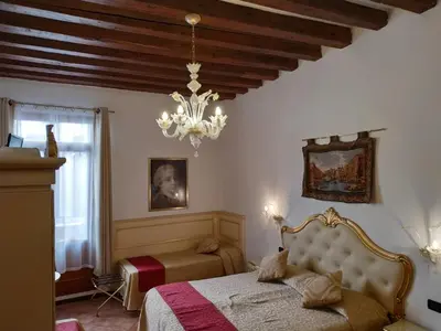 Letto o letti in una camera di Alloggi SS Giovanni e Paolo