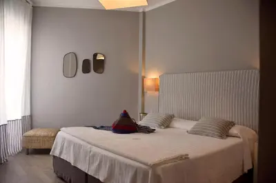Letto o letti in una camera di Hotel Ril