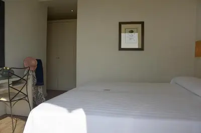 Letto o letti in una camera di Hotel Ril