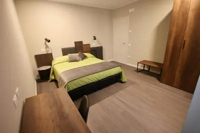 Letto o letti in una camera di Pove 2.4 Hotel