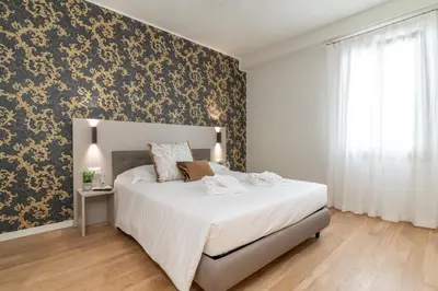 Letto o letti in una camera di Hotel Grifoni