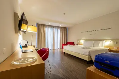 Letto o letti in una camera di UNA Hotels Le Terrazze Treviso Hotel & Residence