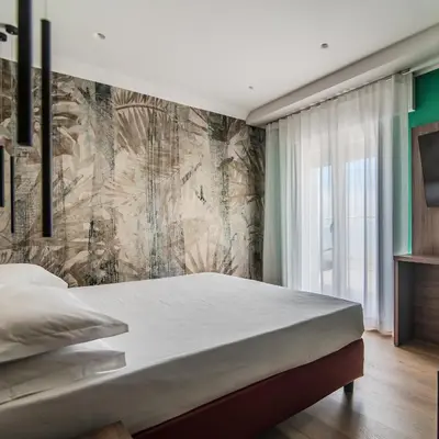 Letto o letti in una camera di Hotel Cesare Augustus