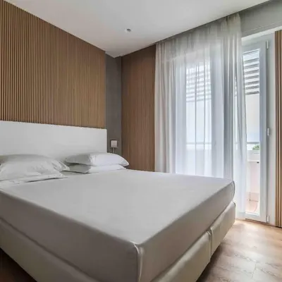 Letto o letti in una camera di Hotel Cesare Augustus