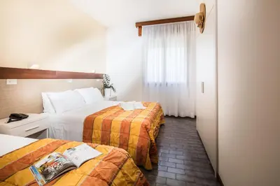 Letto o letti in una camera di Hotel Bettina