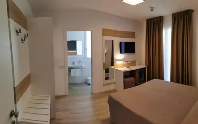 Letto o letti in una camera di Almalux Jesolo Wellness & Spa 3 stelle superior