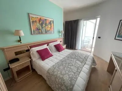 Letto o letti in una camera di Park Hotel Cellini