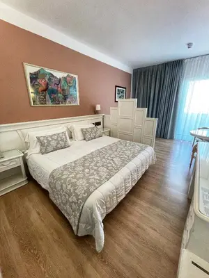 Letto o letti in una camera di Park Hotel Cellini