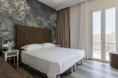 Letto o letti in una camera di Hotel President