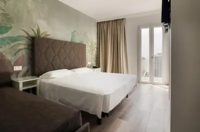 Letto o letti in una camera di Hotel President