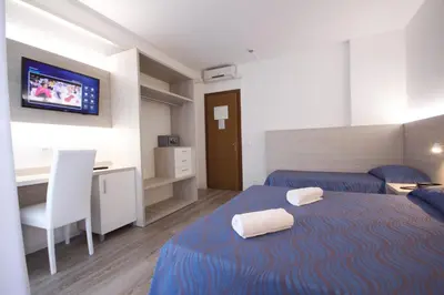 Letto o letti in una camera di Hotel Serenella