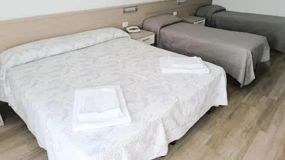Letto o letti in una camera di Hotel Midi