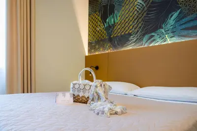 Letto o letti in una camera di Hotel Suez