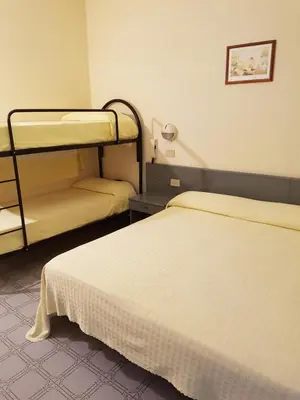 Letto o letti in una camera di Hotel Casa Mia