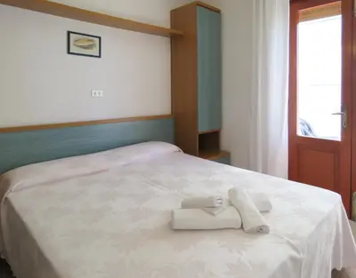 Letto o letti in una camera di Hotel Saturno