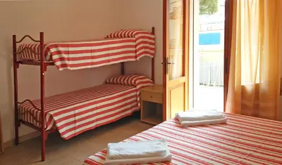 Letto o letti in una camera di Hotel Saturno