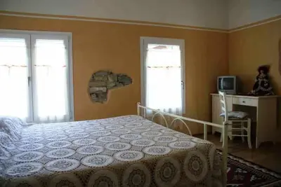 Letto o letti in una camera di Agriturismo Antiche Mura
