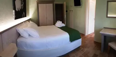 Letto o letti in una camera di Hotel Locanda Dolce Vita