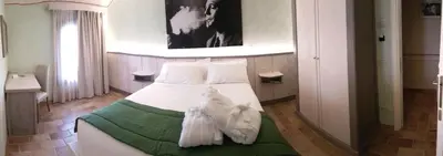 Letto o letti in una camera di Hotel Locanda Dolce Vita