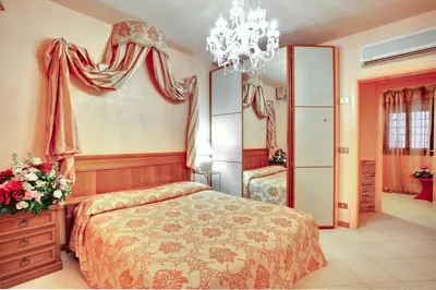 Letto o letti in una camera di Santo Stefano Apartment