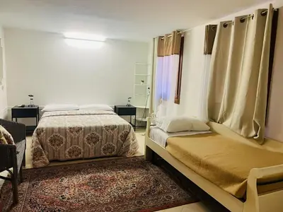 Letto o letti in una camera di Santo Stefano Apartment