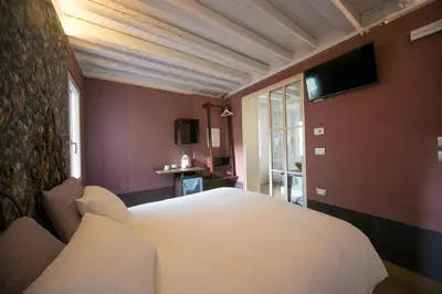 Letto o letti in una camera di Casa Sansera