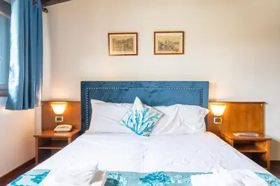 Letto o letti in una camera di Hotel Villa Sara