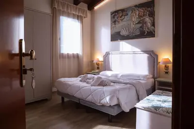 Letto o letti in una camera di Hotel Villa Sara