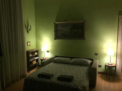 Letto o letti in una camera di Villa Corrado