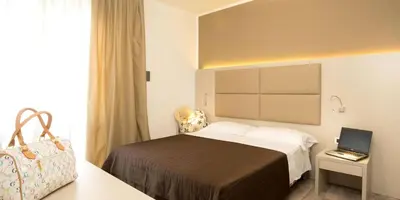 Letto o letti in una camera di Hotel Trevi