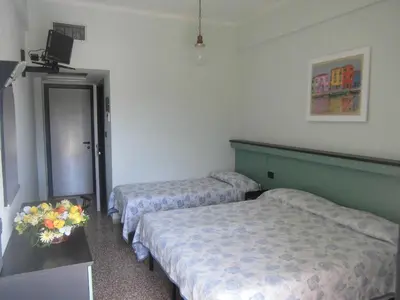 Letto o letti in una camera di Hotel Palm Beach