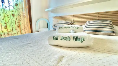 Letto o letti in una camera di Golf Jesolo Venice