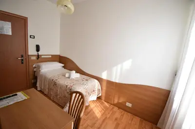 Letto o letti in una camera di Hotel Galles