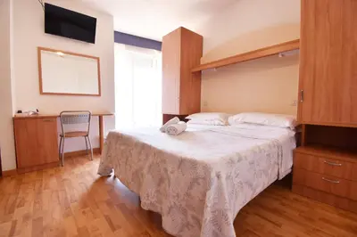 Letto o letti in una camera di Hotel Galles