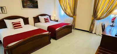 Letto o letti in una camera di Albergo Italia