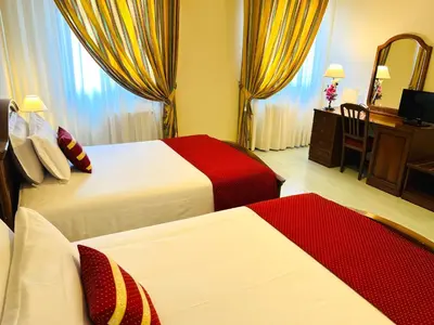 Letto o letti in una camera di Albergo Italia