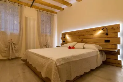 Letto o letti in una camera di Veneziacentopercento Apartments & Rooms