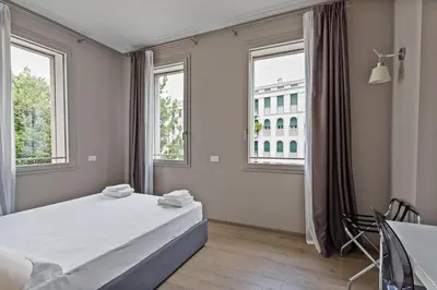 Letto o letti in una camera di JOIVY Treviso Vittoria