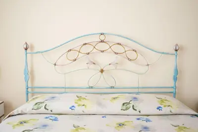 Letto o letti in una camera di B&B BrentaGiardino