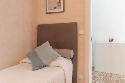 Letto o letti in una camera di San MArtino Apartment
