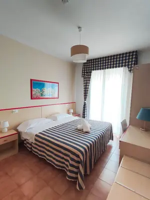 Letto o letti in una camera di Hotel Riviera