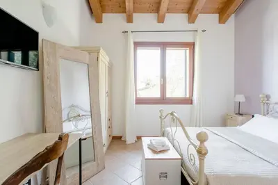 Letto o letti in una camera di Agriturismo Ai Carpini