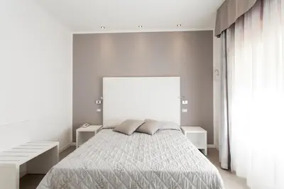 Letto o letti in una camera di Hotel Grottamare
